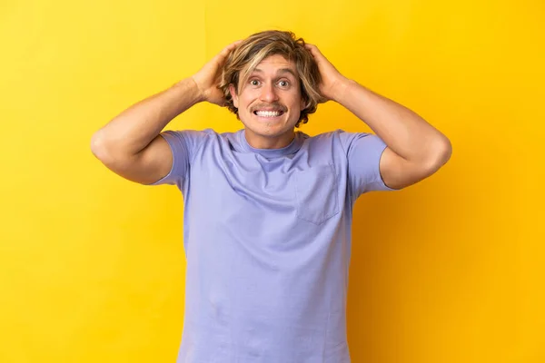 Handsome Blonde Man Isolated Yellow Background Doing Nervous Gesture — Stockfoto