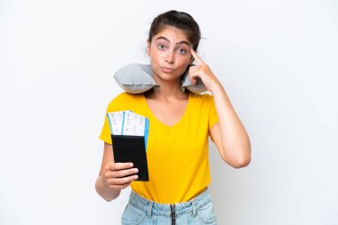 Young caucasian woman with Inflatable travel pillow isolated on white background thinking an idea