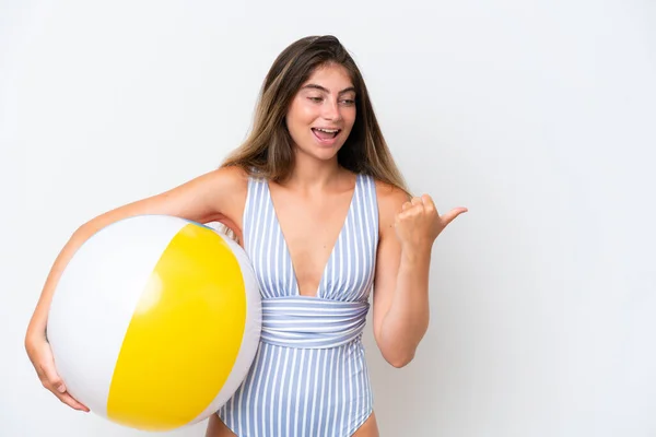 Young Woman Swimsuit Holding Beach Ball Isolated White Background Pointing —  Fotos de Stock