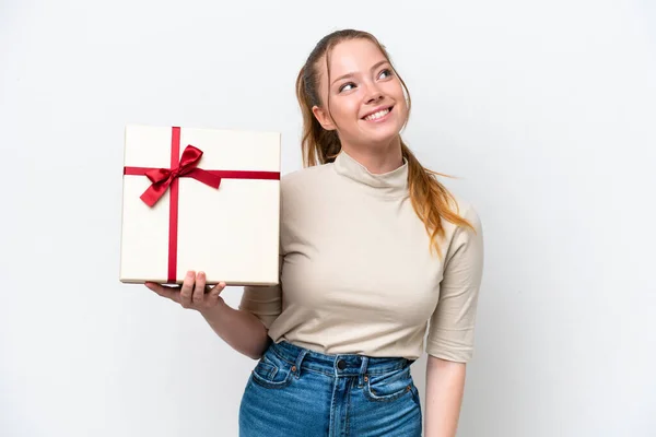 Young Caucasian Woman Holding Gift Isolated White Background Looking While — 스톡 사진