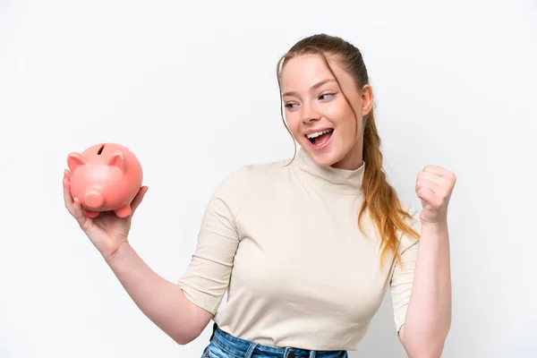 Young Caucasian Girl Holding Piggybank Isolated White Background Celebrating Victory — Foto de Stock