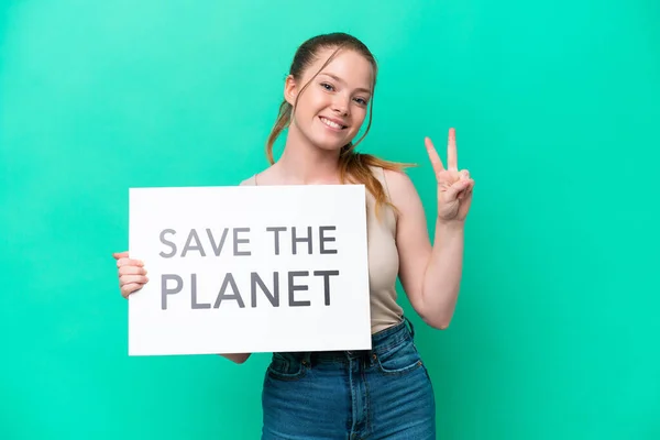 Young Caucasian Woman Isolated Green Background Holding Placard Text Planet — 图库照片