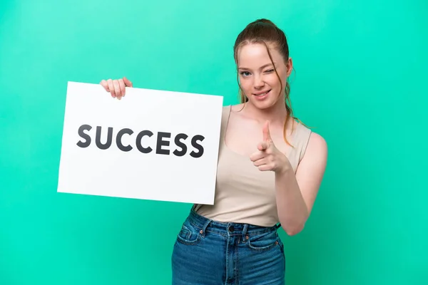 Young Caucasian Woman Isolated Green Background Holding Placard Text Success — Stock Photo, Image