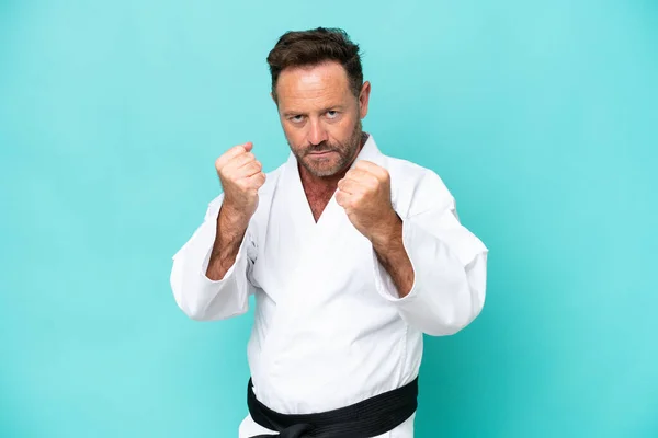 Middle Age Caucasian Man Isolated Blue Background Doing Karate — Foto de Stock