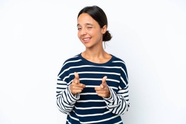 Young hispanic woman isolated on white background pointing to the front and smiling