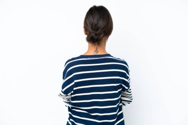 Young hispanic woman isolated on white background in back position