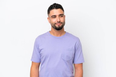 Young Arab handsome man isolated on white background having doubts while looking side