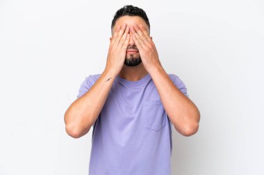 Young Arab handsome man isolated on white background covering eyes by hands