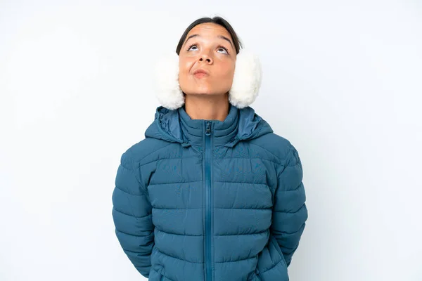 Young Hispanic Woman Wearing Winter Earmuffs Isolated White Background Looking —  Fotos de Stock