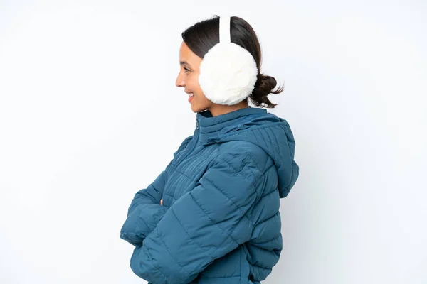 Young Hispanic Woman Wearing Winter Earmuffs Isolated White Background Lateral —  Fotos de Stock