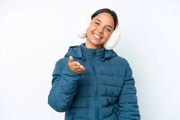 Young Hispanic Woman Wearing Winter Earmuffs Isolated White Background Shaking —  Fotos de Stock