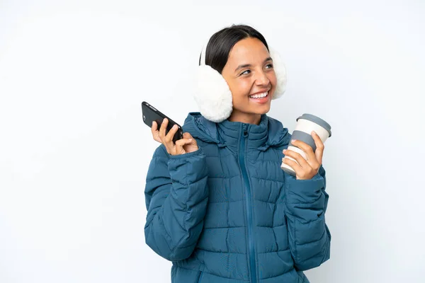 Young Hispanic Woman Wearing Winter Earmuffs Isolated White Background Holding — Fotografia de Stock