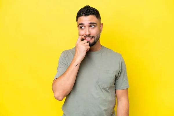Young Arab Handsome Man Isolated Yellow Background Nervous Scared — стокове фото