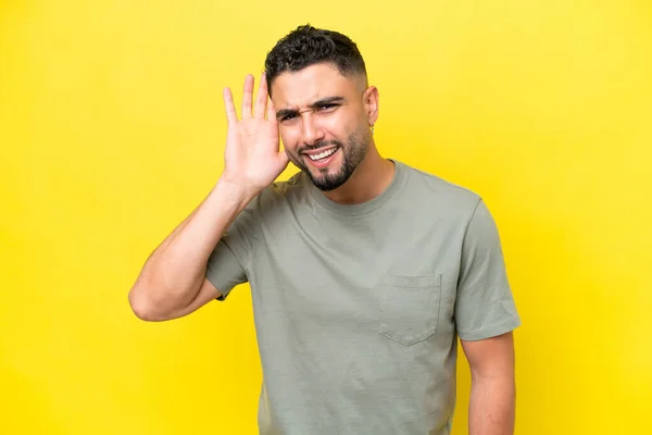 Young Arab Handsome Man Isolated Yellow Background Listening Something Putting — Foto de Stock
