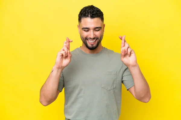 Young Arab Handsome Man Isolated Yellow Background Fingers Crossing — Stock fotografie