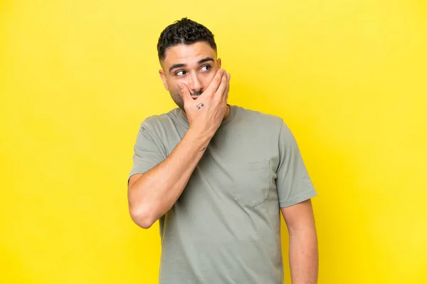 Young Arab Handsome Man Isolated Yellow Background Doing Surprise Gesture — Stok fotoğraf