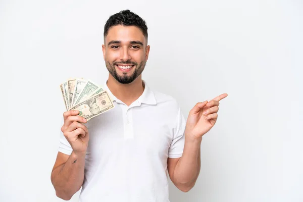 Young Arab Man Taking Lot Money Isolated White Background Pointing — Photo