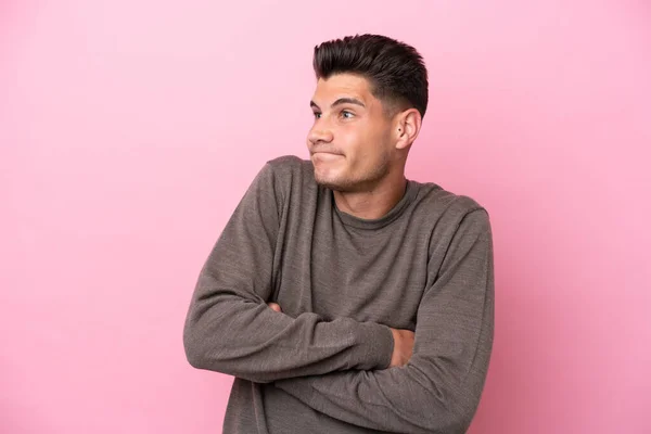 Young Caucasian Man Isolated Pink Background Making Doubts Gesture While — Stock fotografie
