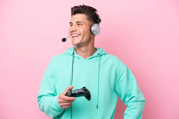 Young Handsome Caucasian Man Playing Video Game Controller Isolated Pink —  Fotos de Stock