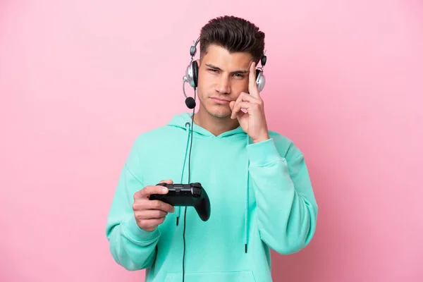 Young Handsome Caucasian Man Playing Video Game Controller Isolated Pink — Stockfoto