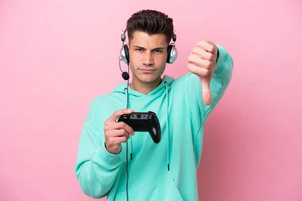 Young Handsome Caucasian Man Playing Video Game Controller Isolated Pink — Stockfoto