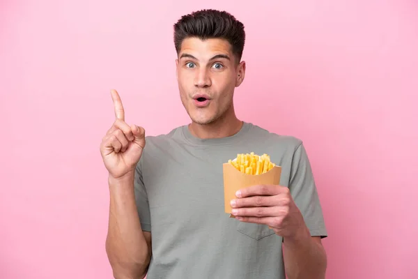 Young Caucasian Man Holding Fried Chips Isolated Pink Background Intending — 图库照片