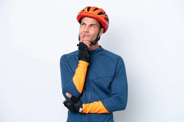 Young Cyclist Caucasian Man Isolated White Background Having Doubts While — Fotografia de Stock