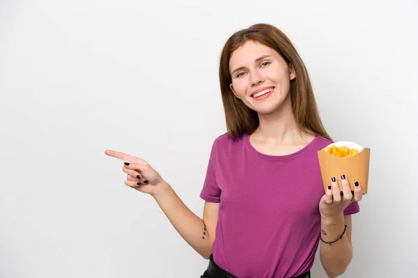 Young English Woman Holding Fried Chips Isolated White Background Pointing — Stockfoto