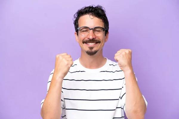 Young Caucasian Man Isolated Purple Background Glasses Celebrating Victory — Foto de Stock