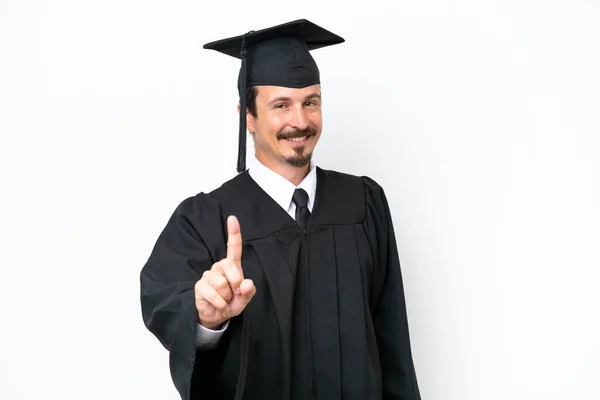 Молодий Випускник Університету Ізольований Білому Тлі Показуючи Піднімаючи Палець — стокове фото