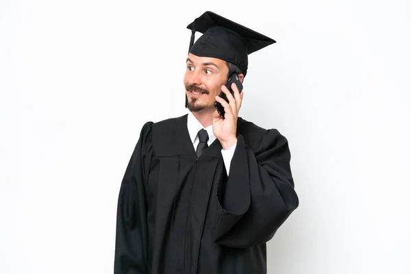 Young University Graduate Man Isolated White Background Keeping Conversation Mobile — Stok fotoğraf