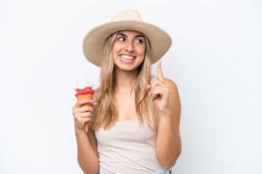 Young caucasian woman with a cornet ice cream isolated on white background intending to realizes the solution while lifting a finger up