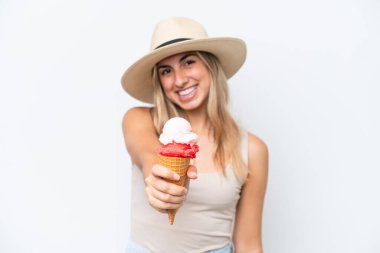 Young caucasian woman with a cornet ice cream isolated on white background with happy expression