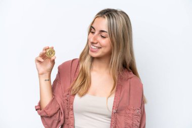 Young caucasian woman holding a Bitcoin isolated on white background with happy expression