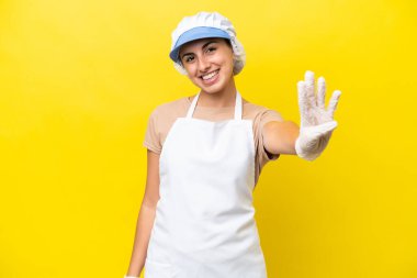 Fishwife woman over isolated background happy and counting four with fingers