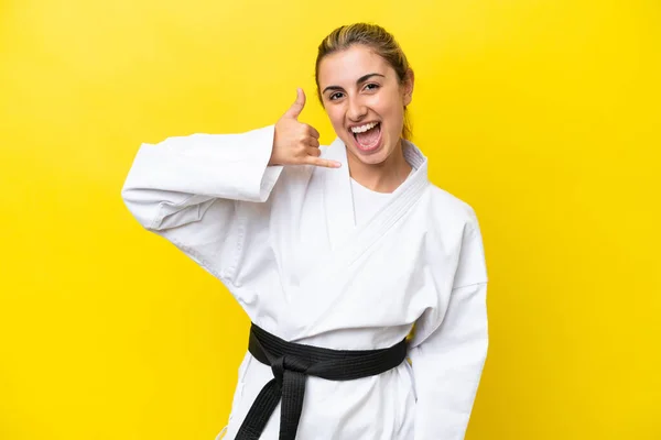 Young Caucasian Woman Doing Karate Isolated Yellow Background Making Phone — Foto de Stock
