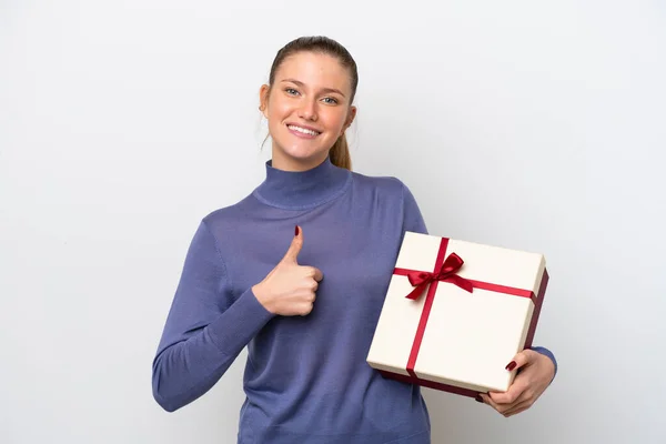 Young Caucasian Woman Holding Gift Isolated White Background Thumbs Because —  Fotos de Stock