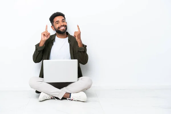 Young Brazilian Man Laptop Sitting Floor Isolated White Pointing Great — 图库照片