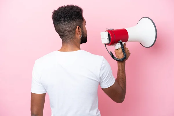 Young Brazilian Man Isolated Pink Background Holding Megaphone Back Position — Photo