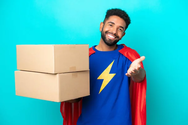 Super Hero Delivery Brazilian Man Isolated Blue Background Shaking Hands — Stock Photo, Image