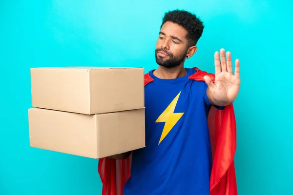 Super Hero Delivery Brazilian Man Isolated Blue Background Making Stop — Stock Photo, Image