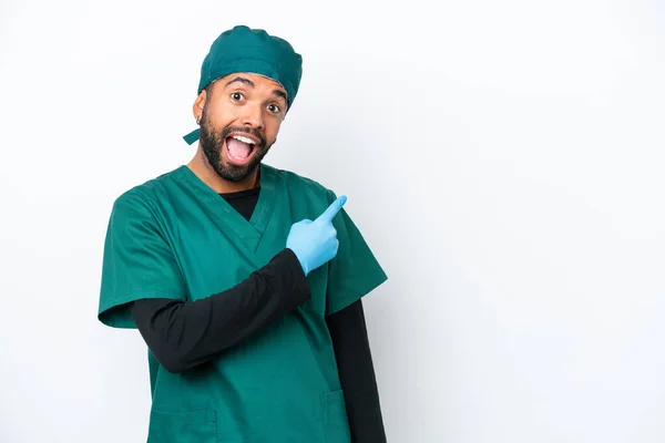 Surgeon Brazilian Man Green Uniform Isolated White Background Surprised Pointing — Fotografia de Stock