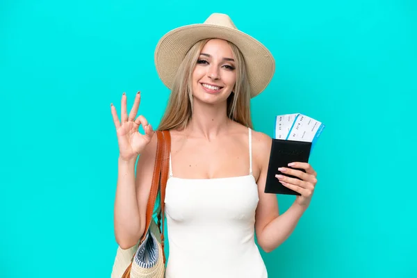 Blonde Woman Swimsuit Holding Passport Isolated Blue Background Showing Sign — Stockfoto