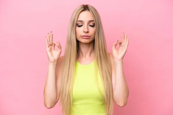 Pretty Blonde Woman Isolated Pink Background Zen Pose — стоковое фото