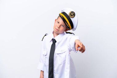 Little airplane pilot boy isolated on white background pointing front with happy expression