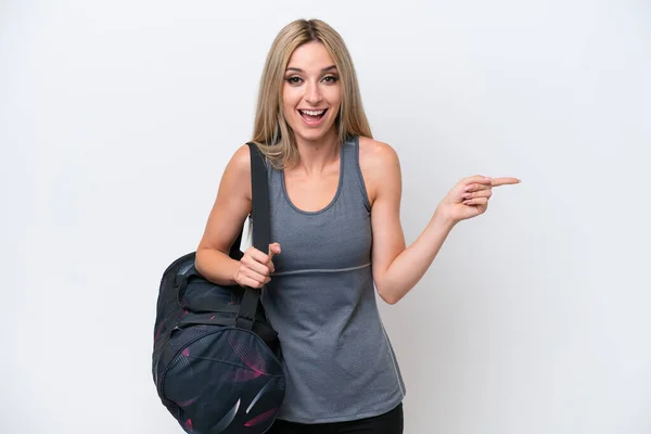 Young Sport Woman Sport Bag Isolated White Background Surprised Pointing — Stok fotoğraf