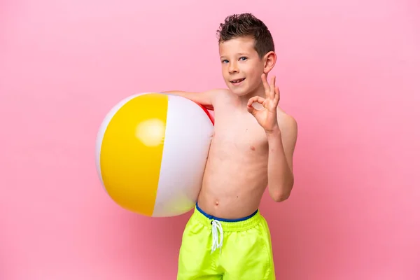 Little Caucasian Boy Holding Beach Ball Isolated Pink Background Showing —  Fotos de Stock