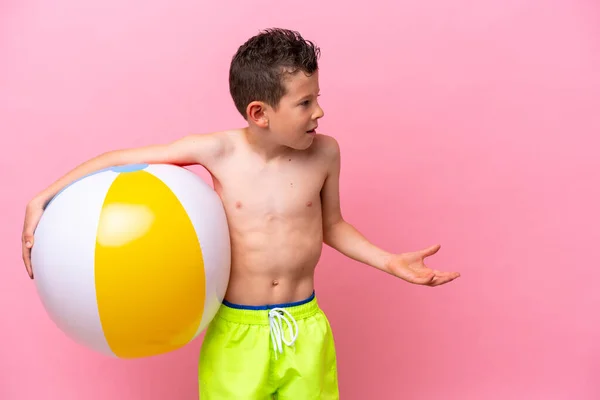 Little Caucasian Boy Holding Beach Ball Isolated Pink Background Surprise —  Fotos de Stock
