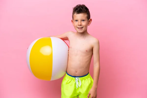 Little Caucasian Boy Holding Beach Ball Isolated Pink Background Smiling —  Fotos de Stock