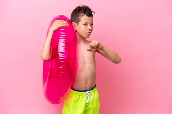 Little Caucasian Boy Holding Inflatable Donut Isolated Pink Background Proud — Photo